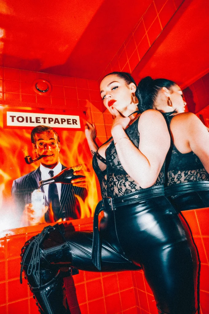 Mistress Charlotte O’Winter in latex before Toiletpaper posters, toilet slave training in London